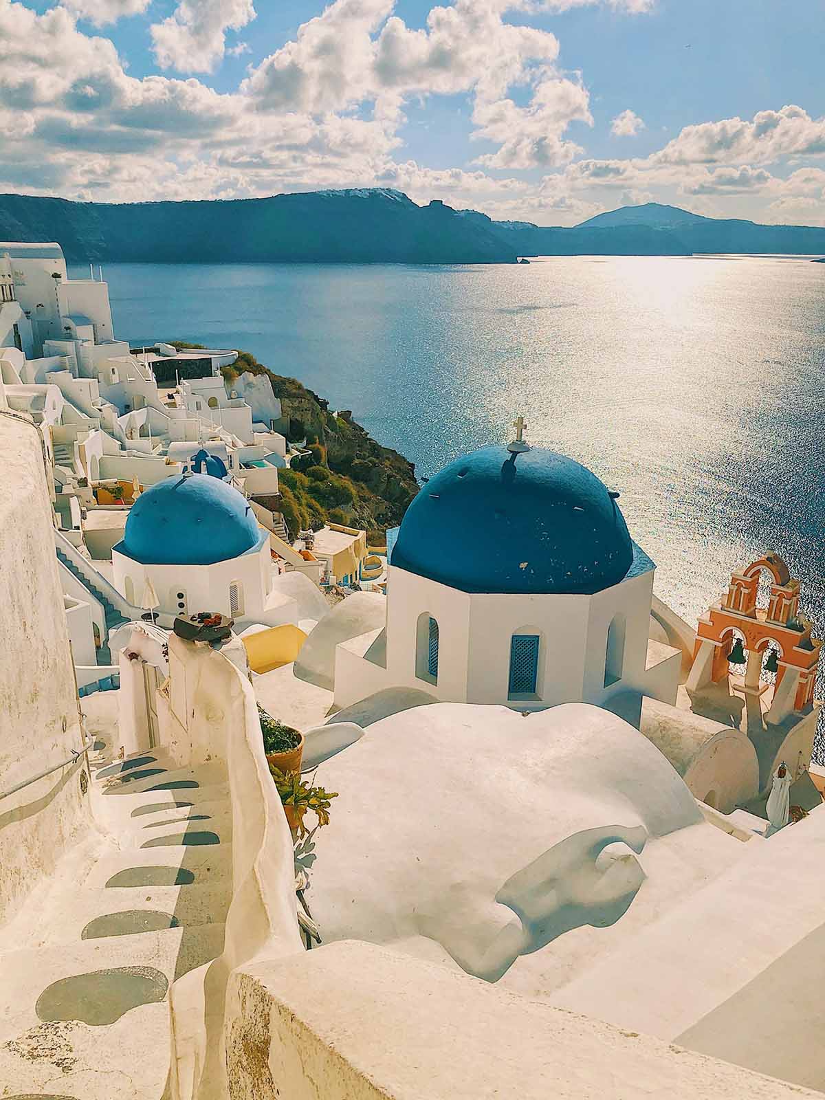 Blue domed church in Oia Santorini overlooking the caldera