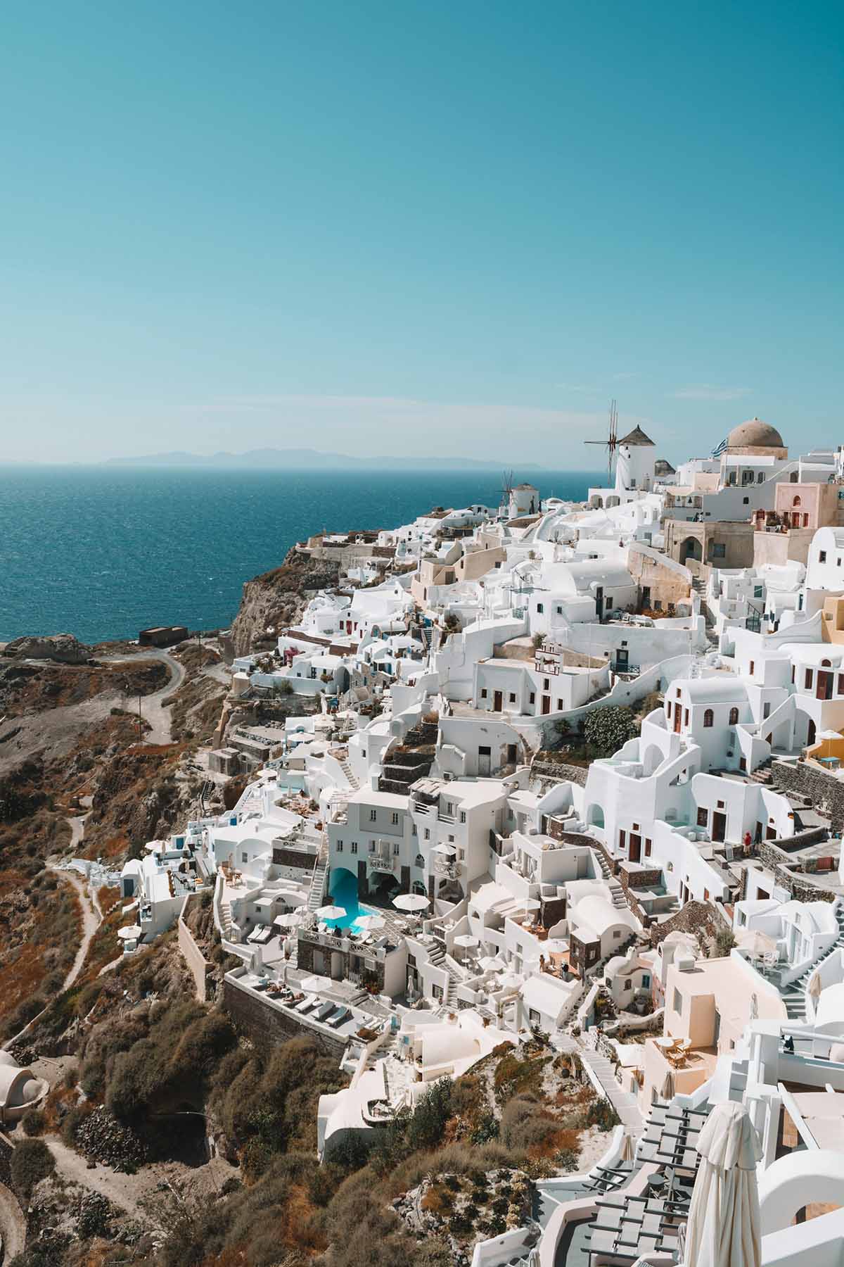 Santorini Greece caldera cliffs with white village and blue sea